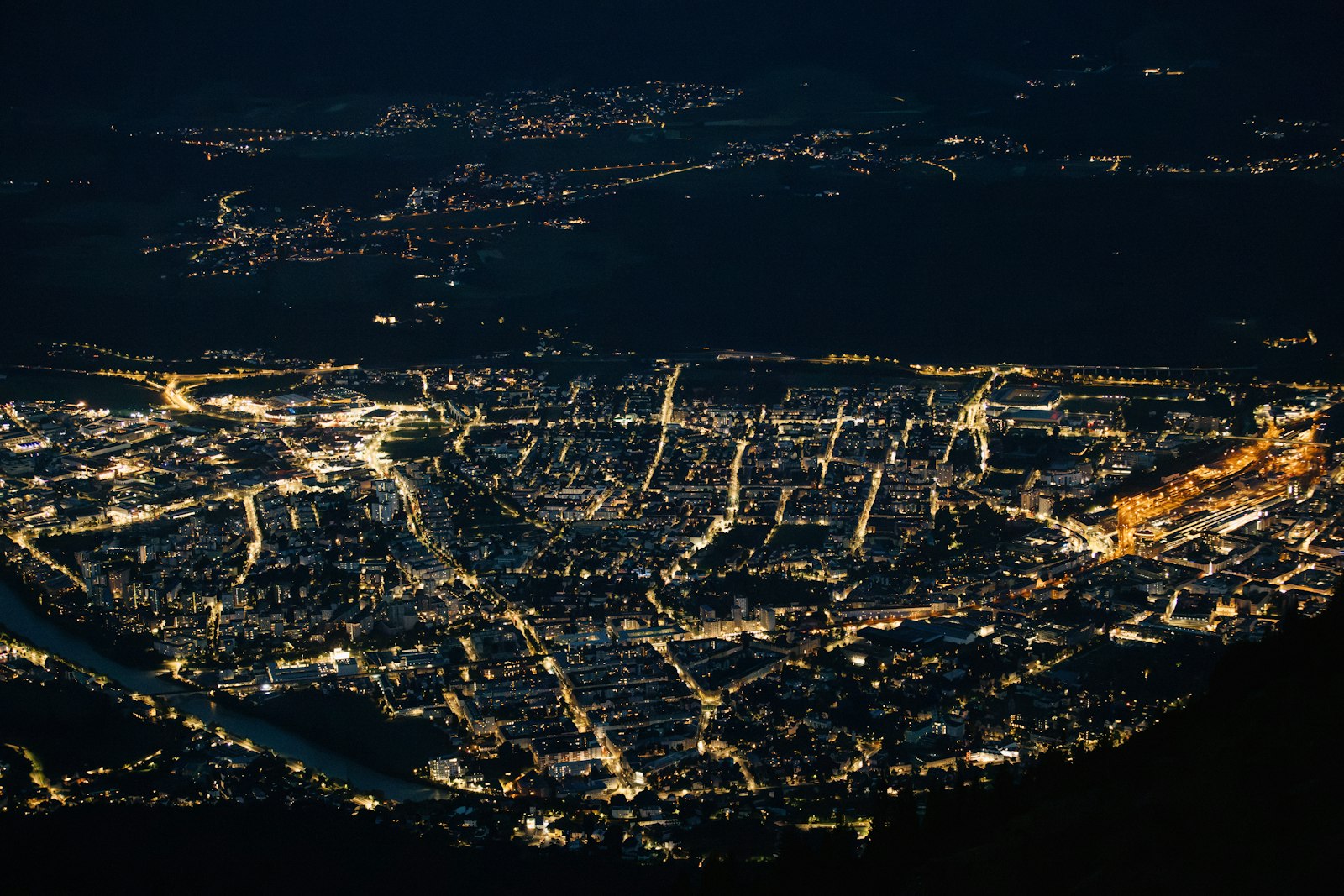 Aerial view of a city grid lit at night